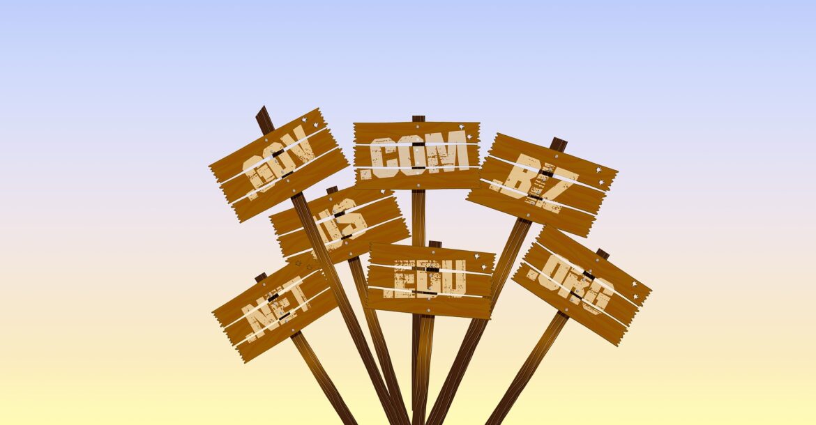Website graphic of domain name LTDs on wooden posts sticking out the ground.